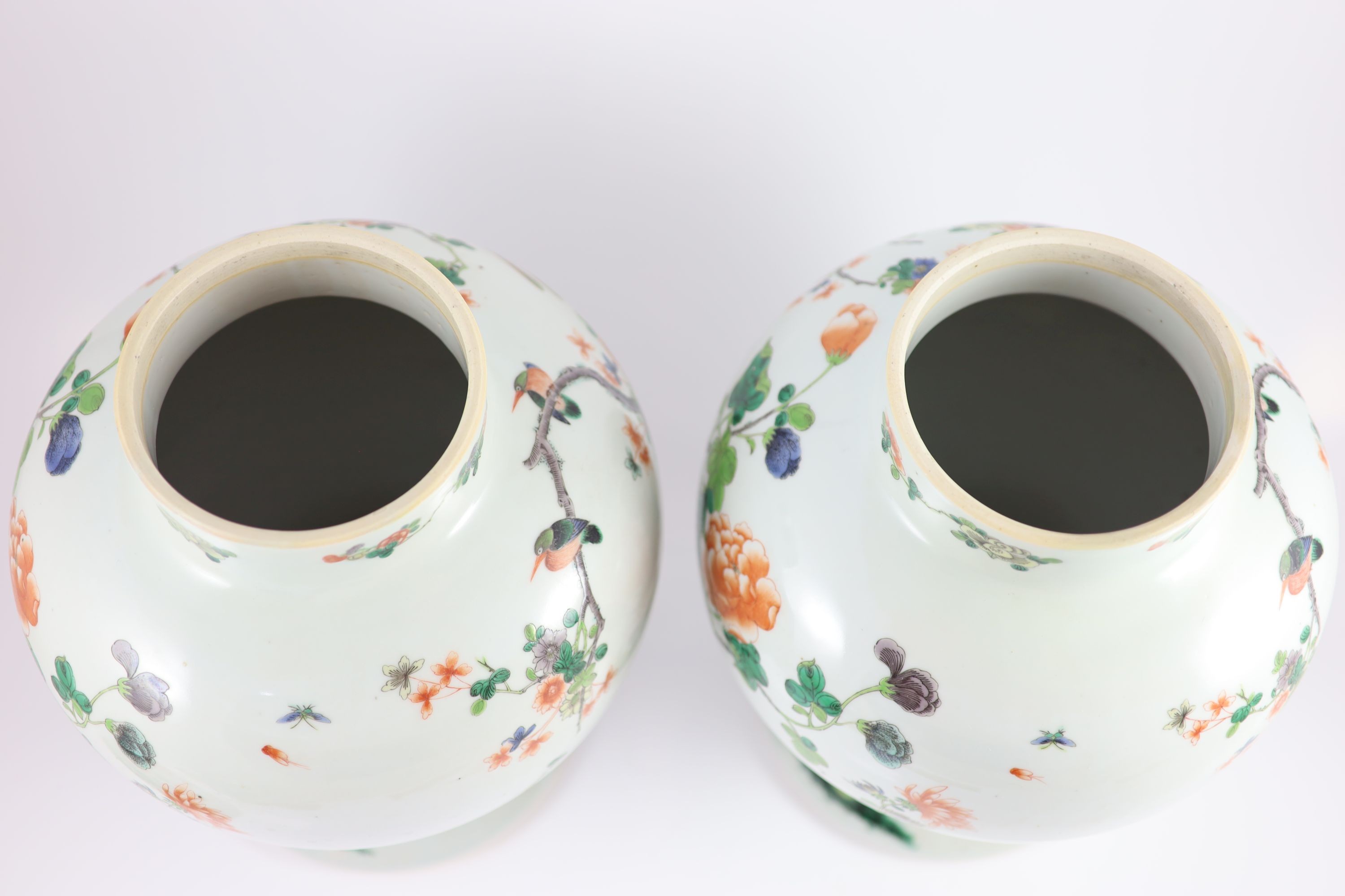 A pair of large Chinese famille verte jars and covers, late 19th century, 45cm high, restoration